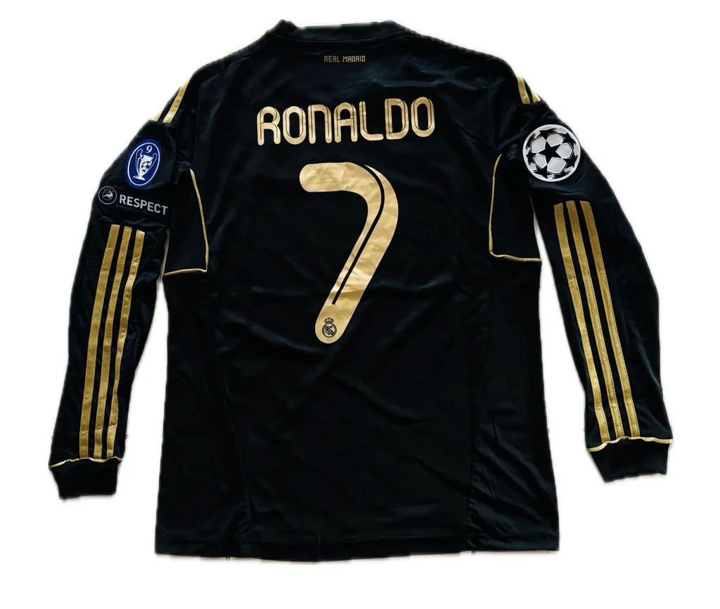 Black soccer jersey with gold lettering and numbering on a white background