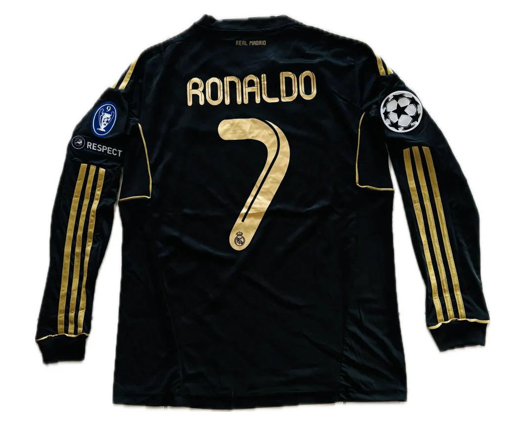 Black soccer jersey with gold lettering and numbering on a white background